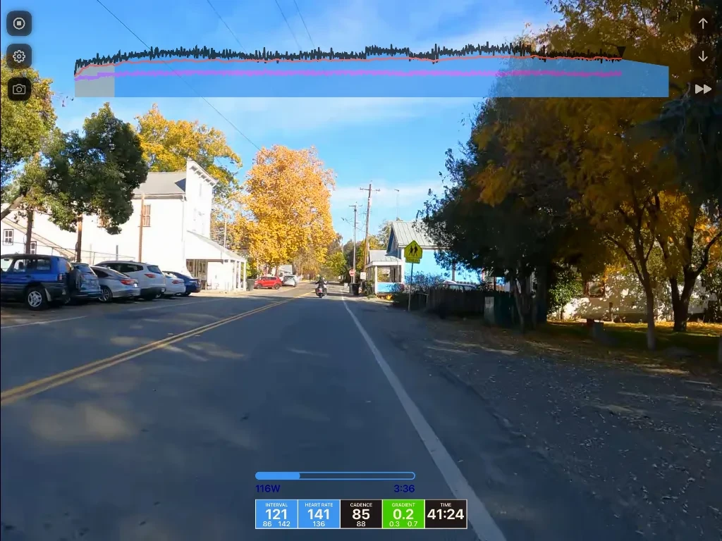 Dashcam footage of a quiet autumn street with parked cars, a white house, trees in fall colors, and vital signs overlay showing heart rate 141 and time 41:24.