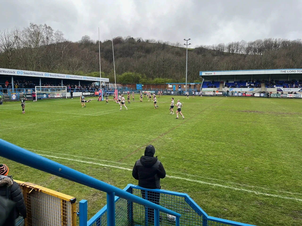 A player slides in near the posts to score a try at Bower Fold